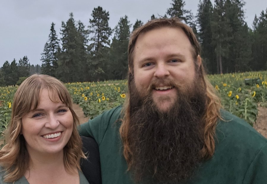 Mark Burgard and his wife in a sunflower field
